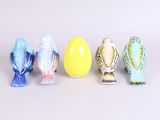 five small birds that are sitting next to each other