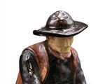 a figurine of a man with a hat on