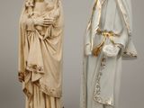 two statues of jesus and a woman holding a child