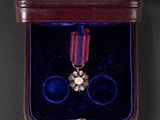 an image of a small box with a medal on it