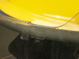 a yellow hard hat sitting on top of a glass table