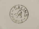 an image of a white plate with a black stamp on it