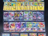 a large collection of pokemon cards are displayed on a table