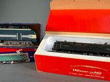 a box with a toy train in it and a box with a toy train in it