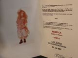 a card with a picture of a doll on it