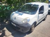 a small white van parked on the side of the road