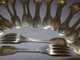 a lot of silver forks and spoons arranged in a circle