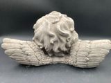 an image of a sculpture of a lion head with wings
