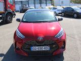 a red car that is parked in a parking lot