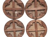 four circular wooden wall shelves with circular designs on them