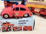two toy cars that are sitting on top of a box