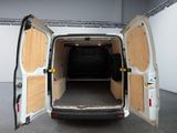 a white van with its doors open in a room