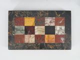 rectangular marble tray with multicolored squares on it
