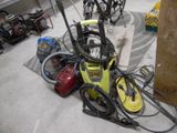une presse à papier jaune posée par terre dans un garage