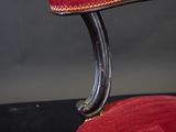 an image of a red chair with a black base
