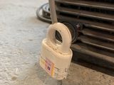 a white padlock on the front of a car