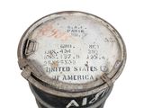 an old metal can with a label on it