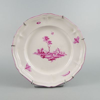a pink and white plate with pink flowers on it