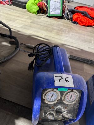 a blue machine that is sitting on a table