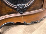 a wooden cabinet with a mirror on top of it