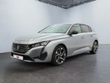 a silver car in a white room with a black floor