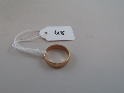 a gold ring with a price tag attached to it