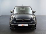 the front view of a small black car parked in a garage