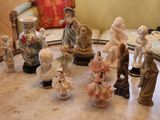 many figurines sitting on a table in a living room