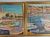 two paintings of boats are hanging on a wall next to each other