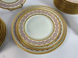 a lot of plates that are sitting on a table