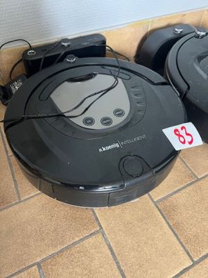 2 aspirateurs robots sur base noirs KOENIG et AMIBOT