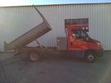 a dump truck that is parked in front of a building