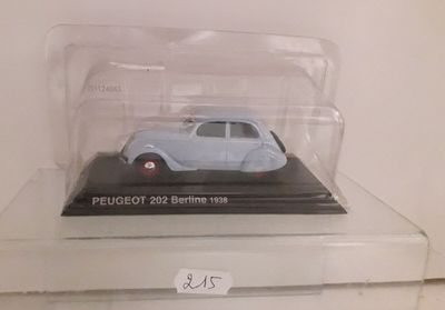 a small toy car in a clear box on a shelf