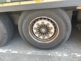 a flat tire on the back of a truck