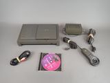 a dvd, cd, and charger sitting on a table