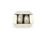 two silver balls in a silver box on a white surface