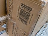 boxes are stacked on top of each other in a room