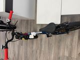 a bike that is hanging on the wall in the kitchen
