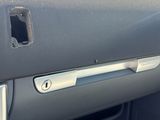 the interior of a car with a hole in the center of the dash