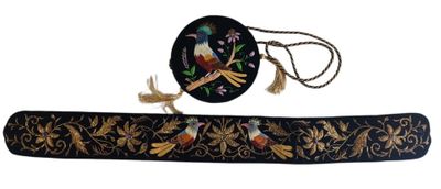 black and gold embroidered belt with birds and flowers on it