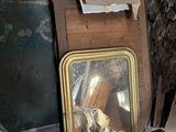 a picture of a mirror sitting on the floor in the corner of a room
