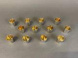 a close up of a bunch of silver cups on a table
