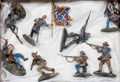 many figurines of soldiers in a display case