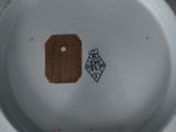 a white plate with a brown tag on it
