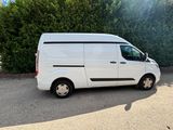 a picture of a white van parked in a parking lot