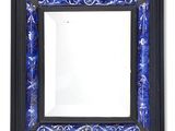 blue and black framed mirror with a floral design