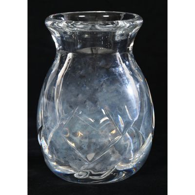 a clear glass vase with a flower inside of it