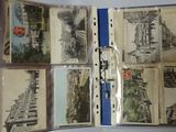 a bunch of old postcards in a binder