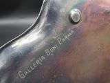a close up of a bike seat on a black surface