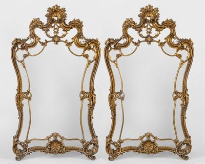 une paire de miroirs dorés à cadre doré